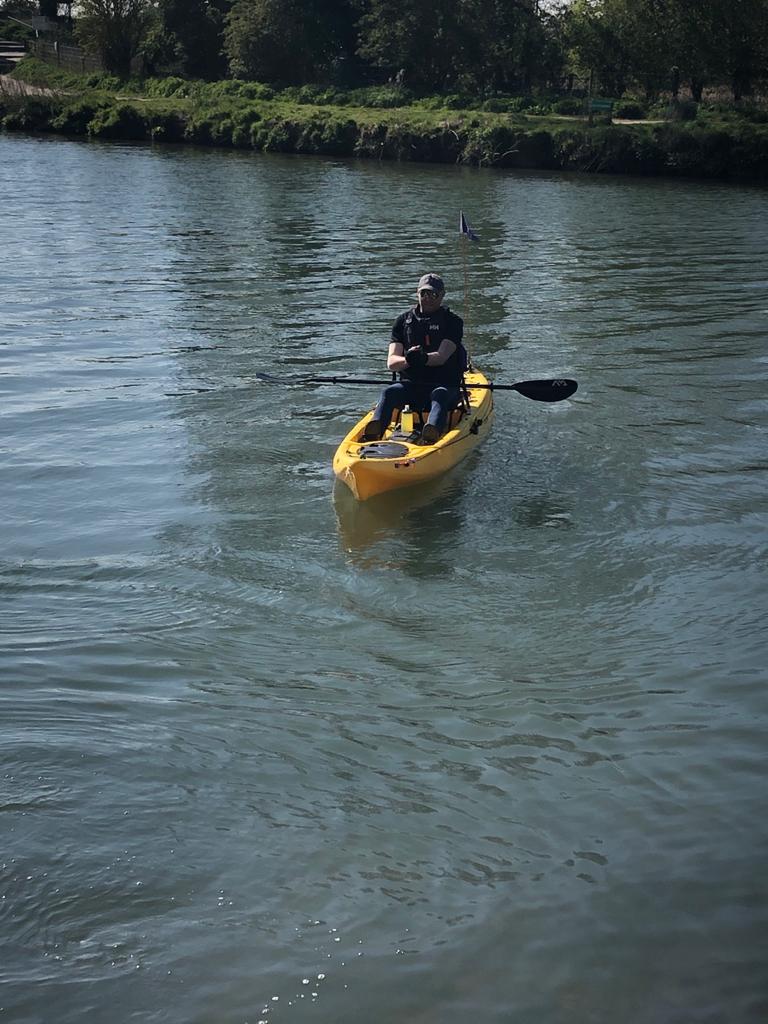 A kayaker paddling in the water