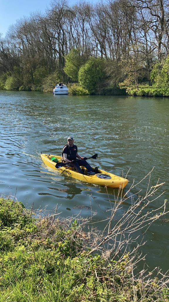 A kayaker paddingly through the Thames.